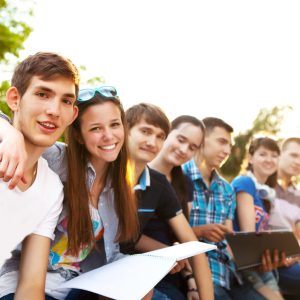 Group,Of,Students,Or,Teenagers,With,Notebooks,Outdoors,In,Summer